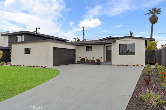 1792 Crestmont Pl, Costa Mesa, CA 92627 - view of front of home with a garage, stucco siding, and driveway