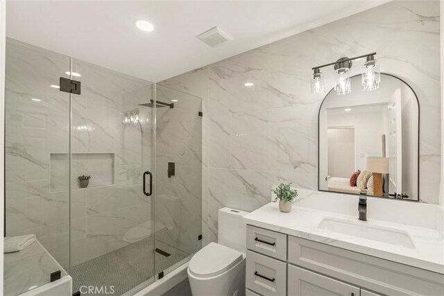 1792 Crestmont Pl, Costa Mesa, CA 92627 - bathroom with tile walls, vanity, a marble finish shower, toilet, and recessed lighting