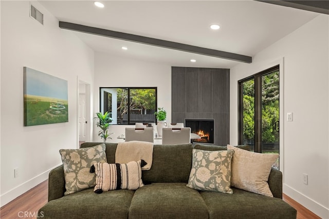 1792 Crestmont Pl, Costa Mesa, CA 92627 - living room featuring beam ceiling, recessed lighting, baseboards, a fireplace, and wood finished floors
