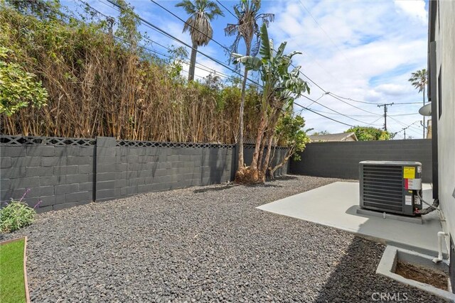 1792 Crestmont Pl, Costa Mesa, CA 92627 - fenced backyard with central AC unit and a patio area