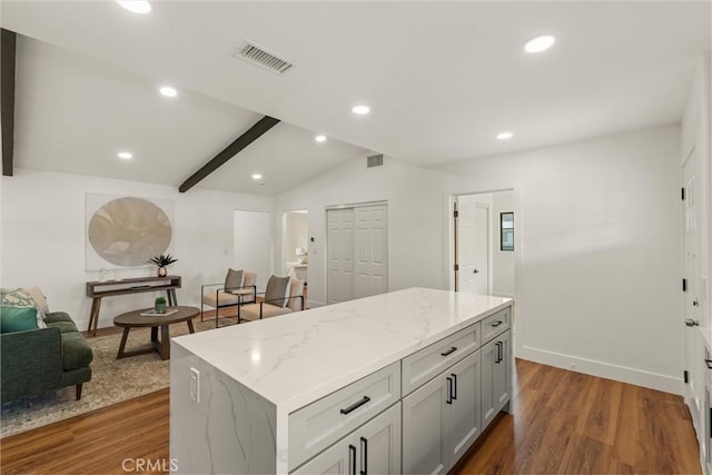 1792 Crestmont Pl, Costa Mesa, CA 92627 - kitchen with dark wood-style flooring, a kitchen island, light stone countertops, open floor plan, and recessed lighting