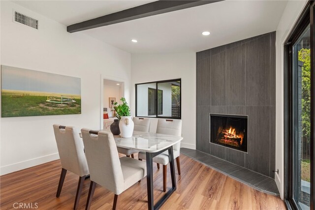 1792 Crestmont Pl, Costa Mesa, CA 92627 - dining area featuring wood finished floors, recessed lighting, a fireplace, baseboards, and beam ceiling