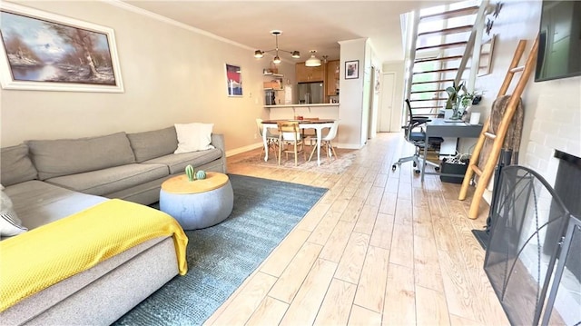 5951 Canterbury Dr Unit 17, Culver City, CA 90230 - living area with light wood-style floors, crown molding, and baseboards