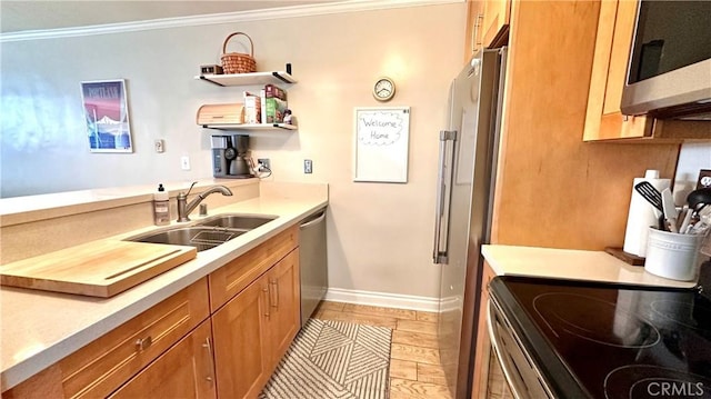 5951 Canterbury Dr Unit 17, Culver City, CA 90230 - kitchen featuring a sink, appliances with stainless steel finishes, brown cabinets, ornamental molding, and light countertops