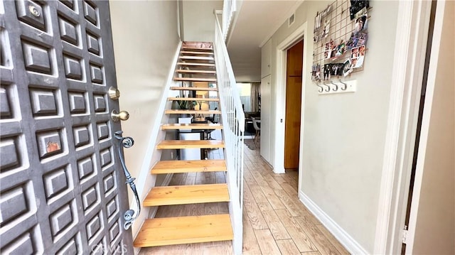 5951 Canterbury Dr Unit 17, Culver City, CA 90230 - stairs featuring wood finished floors and baseboards