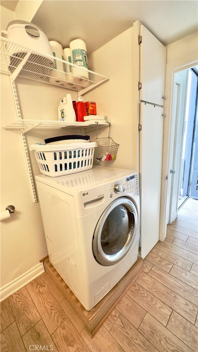 5951 Canterbury Dr Unit 17, Culver City, CA 90230 - laundry room featuring washer / dryer and light wood finished floors