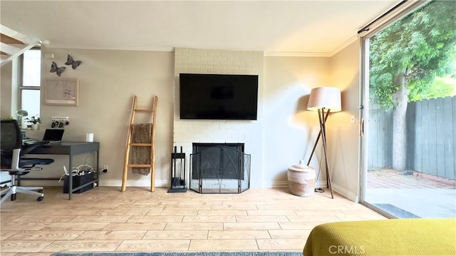 5951 Canterbury Dr Unit 17, Culver City, CA 90230 - office area with ornamental molding, light wood-style flooring, plenty of natural light, a fireplace, and baseboards
