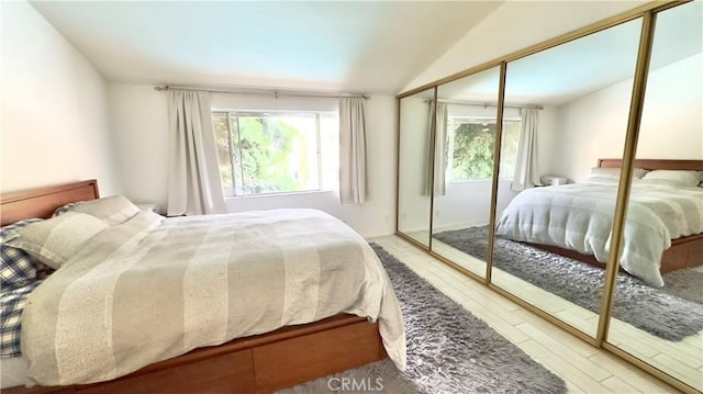 5951 Canterbury Dr Unit 17, Culver City, CA 90230 - bedroom featuring wood finished floors, multiple windows, and lofted ceiling