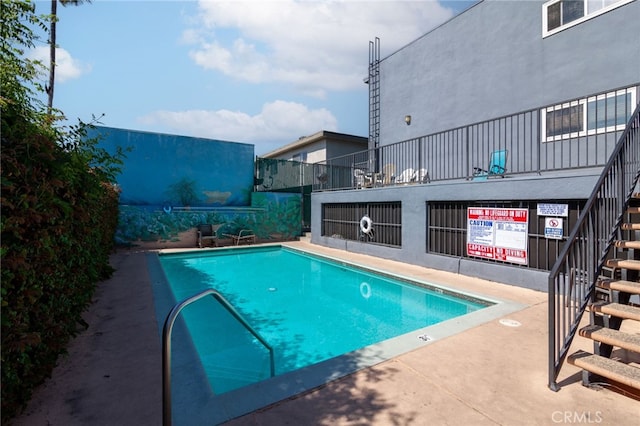 5706 Fair Ave Unit 100, North Hollywood, CA 91601 - community pool featuring stairs and a patio area