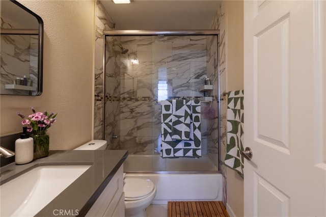 5706 Fair Ave Unit 100, North Hollywood, CA 91601 - bathroom with vanity, toilet, combined bath / shower with glass door, and a textured wall
