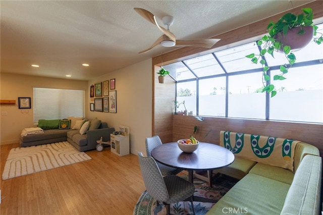 5706 Fair Ave Unit 100, North Hollywood, CA 91601 - dining area featuring wood finished floors, a ceiling fan, recessed lighting, and a textured ceiling