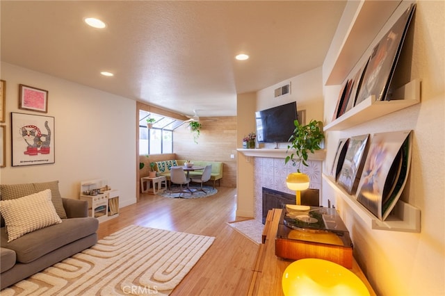 5706 Fair Ave Unit 100, North Hollywood, CA 91601 - living area with wood finished floors, recessed lighting, and a fireplace