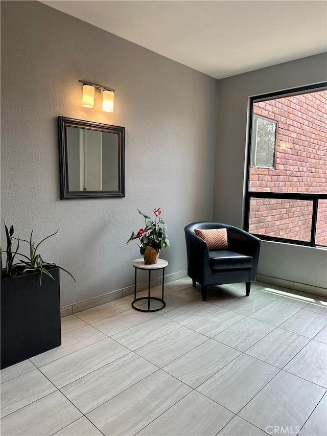 700 S Lake Ave Unit 305, Pasadena, CA 91106 - living area featuring light tile patterned flooring and baseboards