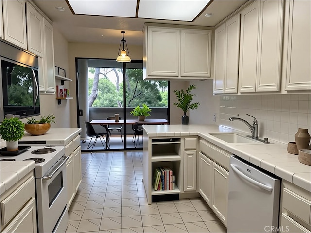 700 S Lake Ave Unit 305, Pasadena, CA 91106 - kitchen with white appliances, a sink, open shelves, tile countertops, and decorative backsplash