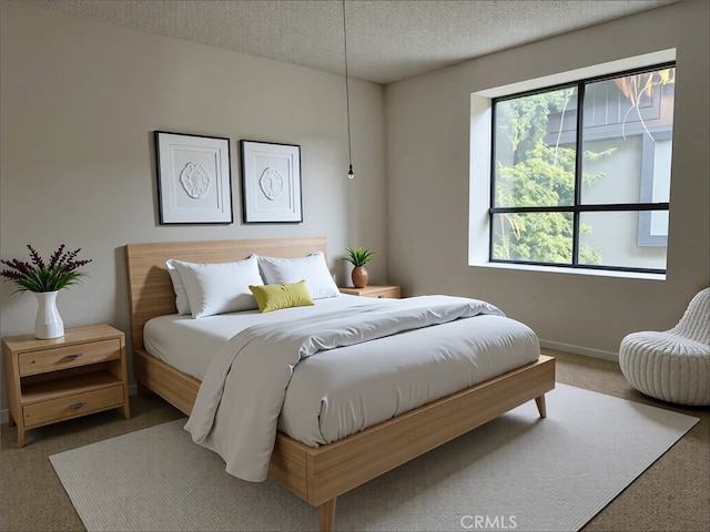700 S Lake Ave Unit 305, Pasadena, CA 91106 - bedroom featuring carpet floors, baseboards, and a textured ceiling