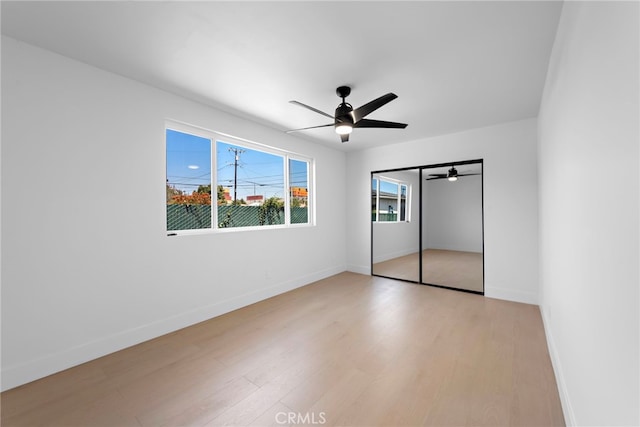 1005 E Cruces St, Wilmington, CA 90744 - unfurnished bedroom with light wood-style floors, baseboards, a closet, and a ceiling fan