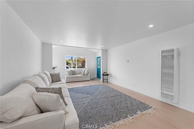 1005 E Cruces St, Wilmington, CA 90744 - living room with a heating unit, recessed lighting, wood finished floors, and baseboards