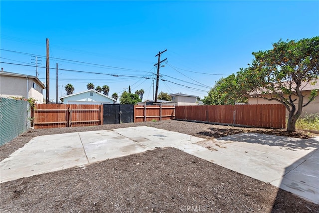 1005 E Cruces St, Wilmington, CA 90744 - fenced backyard featuring a patio area
