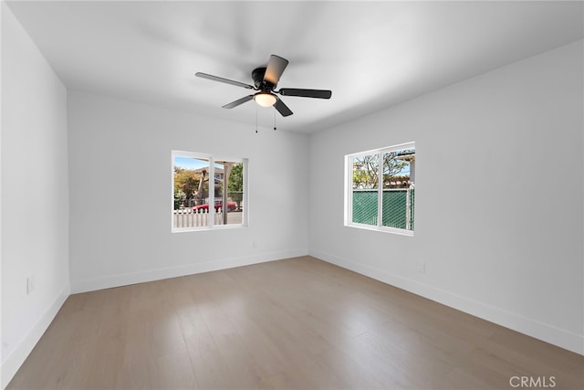 1005 E Cruces St, Wilmington, CA 90744 - spare room with healthy amount of natural light, light wood finished floors, a ceiling fan, and baseboards