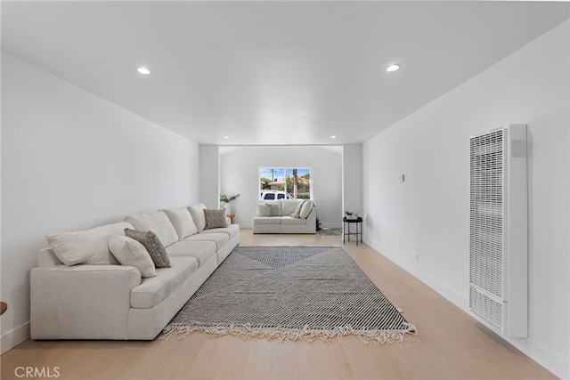 1005 E Cruces St, Wilmington, CA 90744 - living room with a heating unit, recessed lighting, light wood finished floors, and baseboards