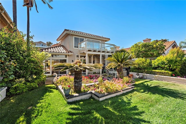 30252 Sonrisa Ln, Laguna Niguel, CA 92677 - rear view of property with a tiled roof, a balcony, a lawn, a garden, and a chimney