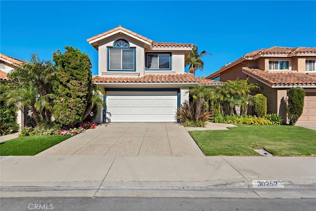 30252 Sonrisa Ln, Laguna Niguel, CA 92677 - mediterranean / spanish home featuring an attached garage, stucco siding, concrete driveway, a front yard, and a tile roof