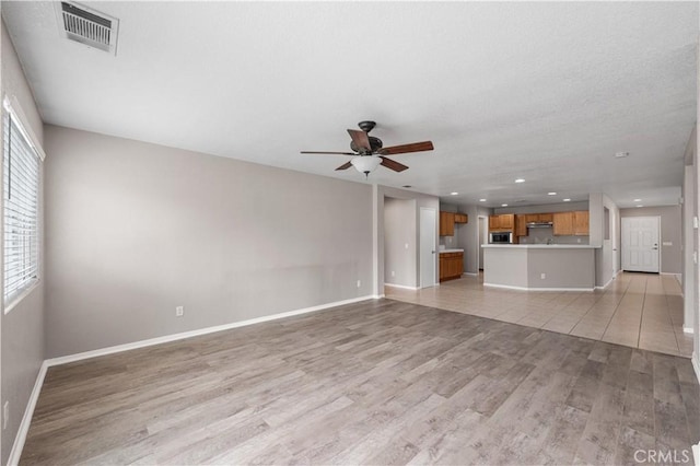 3057 Kilt Ct, Lancaster, CA 93535 - unfurnished living room with a ceiling fan, light wood finished floors, baseboards, and recessed lighting