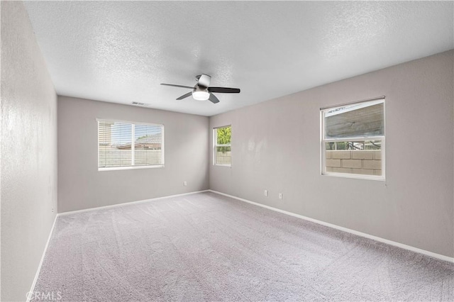 3057 Kilt Ct, Lancaster, CA 93535 - carpeted spare room featuring a ceiling fan, a textured ceiling, and baseboards