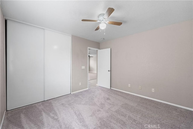 3057 Kilt Ct, Lancaster, CA 93535 - unfurnished bedroom with a closet, carpet, baseboards, and a ceiling fan