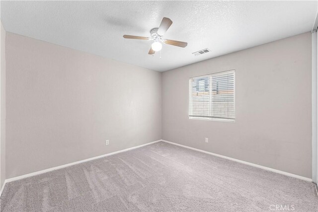3057 Kilt Ct, Lancaster, CA 93535 - unfurnished room featuring a ceiling fan, carpet floors, a textured ceiling, and baseboards