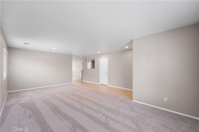 3057 Kilt Ct, Lancaster, CA 93535 - empty room featuring light carpet, baseboards, and recessed lighting