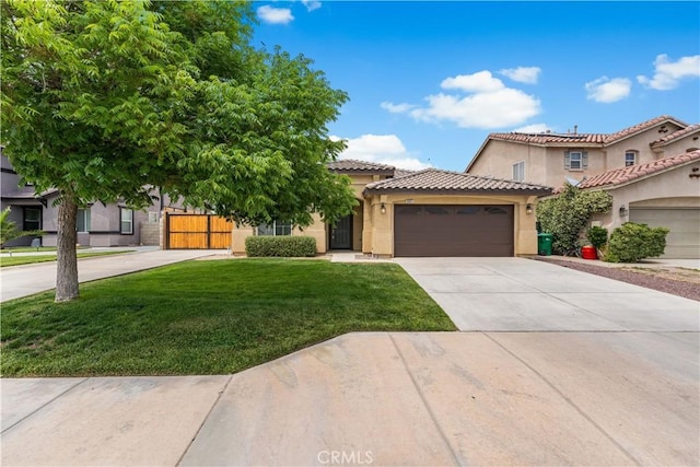 3057 Kilt Ct, Lancaster, CA 93535 - view of front of property featuring an attached garage, driveway, a front yard, and stucco siding