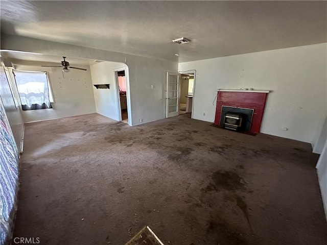 2233 Marguerite St, Dos Palos, CA 93620 - unfurnished living room with ceiling fan, carpet floors, and a fireplace