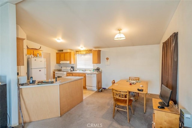 5131 Cygnet Rd A-B, Unit A-B Phelan, CA 92371 - kitchen featuring white appliances, lofted ceiling, a peninsula, light countertops, and light carpet