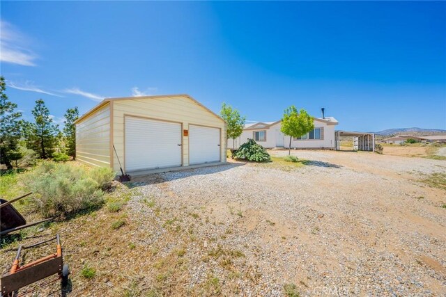 5131 Cygnet Rd A-B, Unit A-B Phelan, CA 92371 - view of front facade with a garage and an outdoor structure