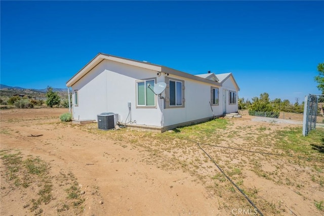 5131 Cygnet Rd A-B, Unit A-B Phelan, CA 92371 - rear view of property with central AC unit