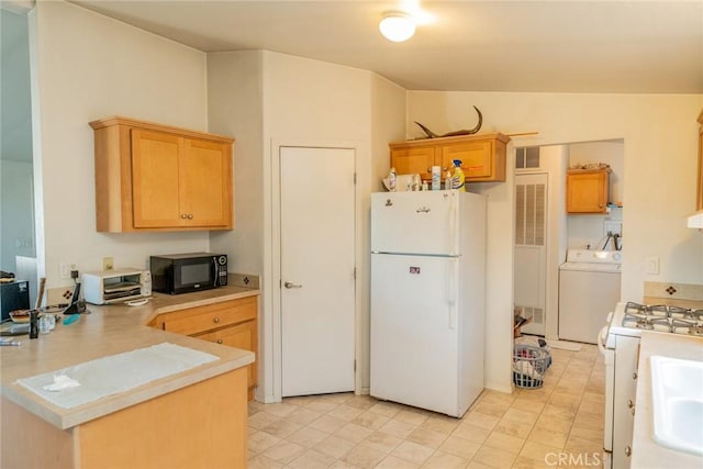 5131 Cygnet Rd A-B, Unit A-B Phelan, CA 92371 - kitchen with white appliances, washer / dryer, light countertops, a peninsula, and a sink