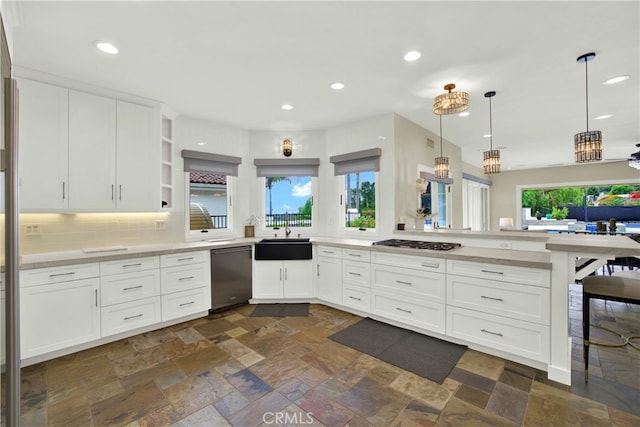 30927 Steeplechase Dr, San Juan Capistrano, CA 92675 - kitchen featuring dishwashing machine, a sink, stainless steel gas cooktop, light countertops, and recessed lighting