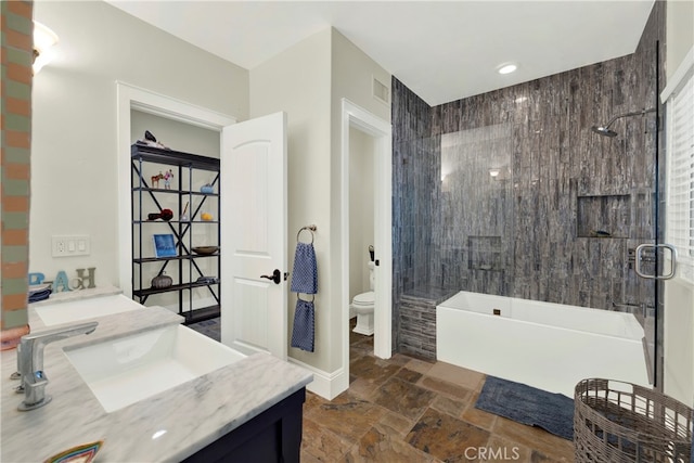 30927 Steeplechase Dr, San Juan Capistrano, CA 92675 - bathroom with toilet, double vanity, stone tile flooring, and  shower combination