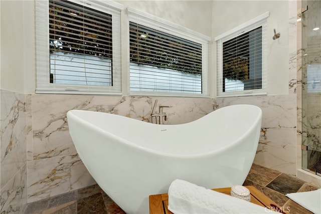 30927 Steeplechase Dr, San Juan Capistrano, CA 92675 - bathroom with tile walls, marble tiled floors, a freestanding bath, plenty of natural light, and a shower stall