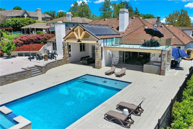 30927 Steeplechase Dr, San Juan Capistrano, CA 92675 - rear view of property featuring a patio area, a chimney, stucco siding, a residential view, and a tiled roof