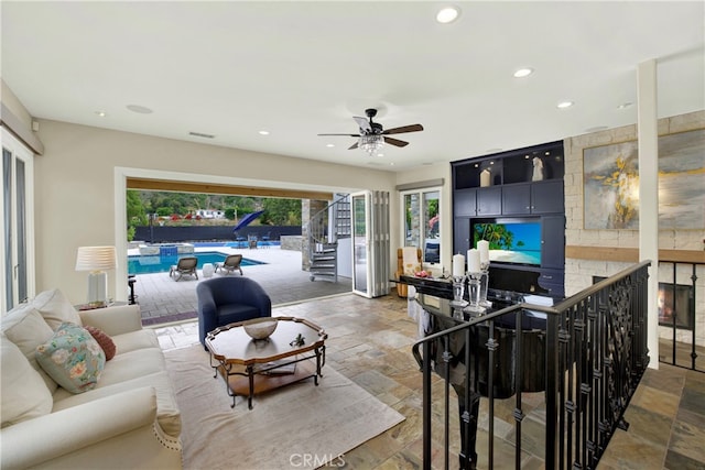 30927 Steeplechase Dr, San Juan Capistrano, CA 92675 - living room featuring stone tile floors, recessed lighting, a ceiling fan, and stairway