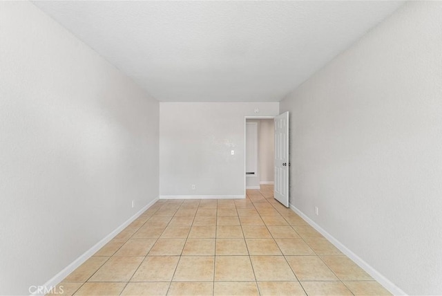 2101 Thomas Dr, Lancaster, CA 93535 - unfurnished room with baseboards and light tile patterned flooring
