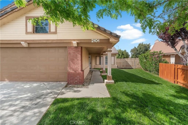 2101 Thomas Dr, Lancaster, CA 93535 - view of front of home with concrete driveway and an attached garage