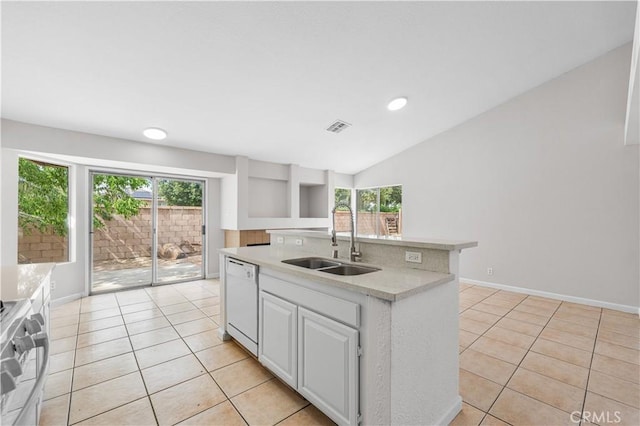 2101 Thomas Dr, Lancaster, CA 93535 - kitchen with dishwasher, a sink, light countertops, range, and light tile patterned flooring