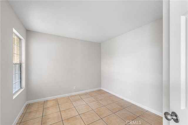 2101 Thomas Dr, Lancaster, CA 93535 - spare room featuring light tile patterned flooring and baseboards