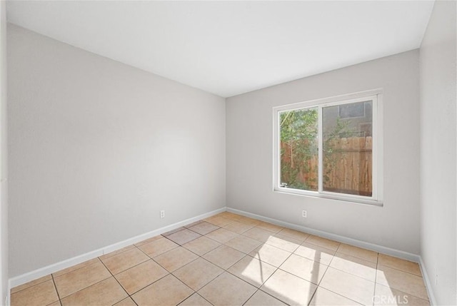 2101 Thomas Dr, Lancaster, CA 93535 - spare room with light tile patterned flooring and baseboards