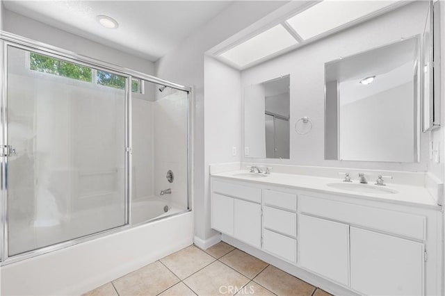 2101 Thomas Dr, Lancaster, CA 93535 - full bathroom with tile patterned floors, shower / bath combination with glass door, and double vanity