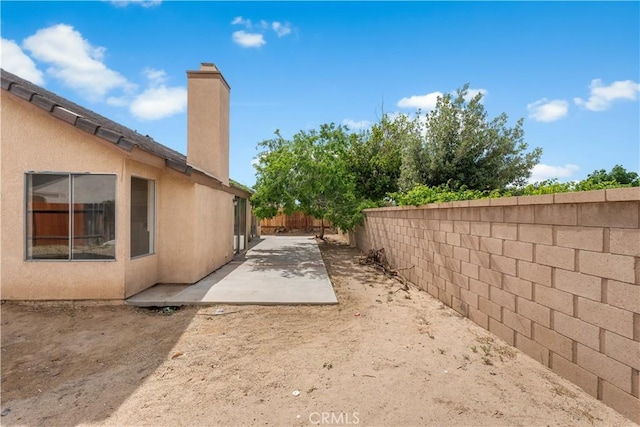 2101 Thomas Dr, Lancaster, CA 93535 - fenced backyard featuring a patio area