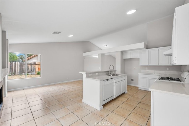 2101 Thomas Dr, Lancaster, CA 93535 - kitchen featuring white dishwasher, a sink, lofted ceiling, ventilation hood, and light tile patterned floors